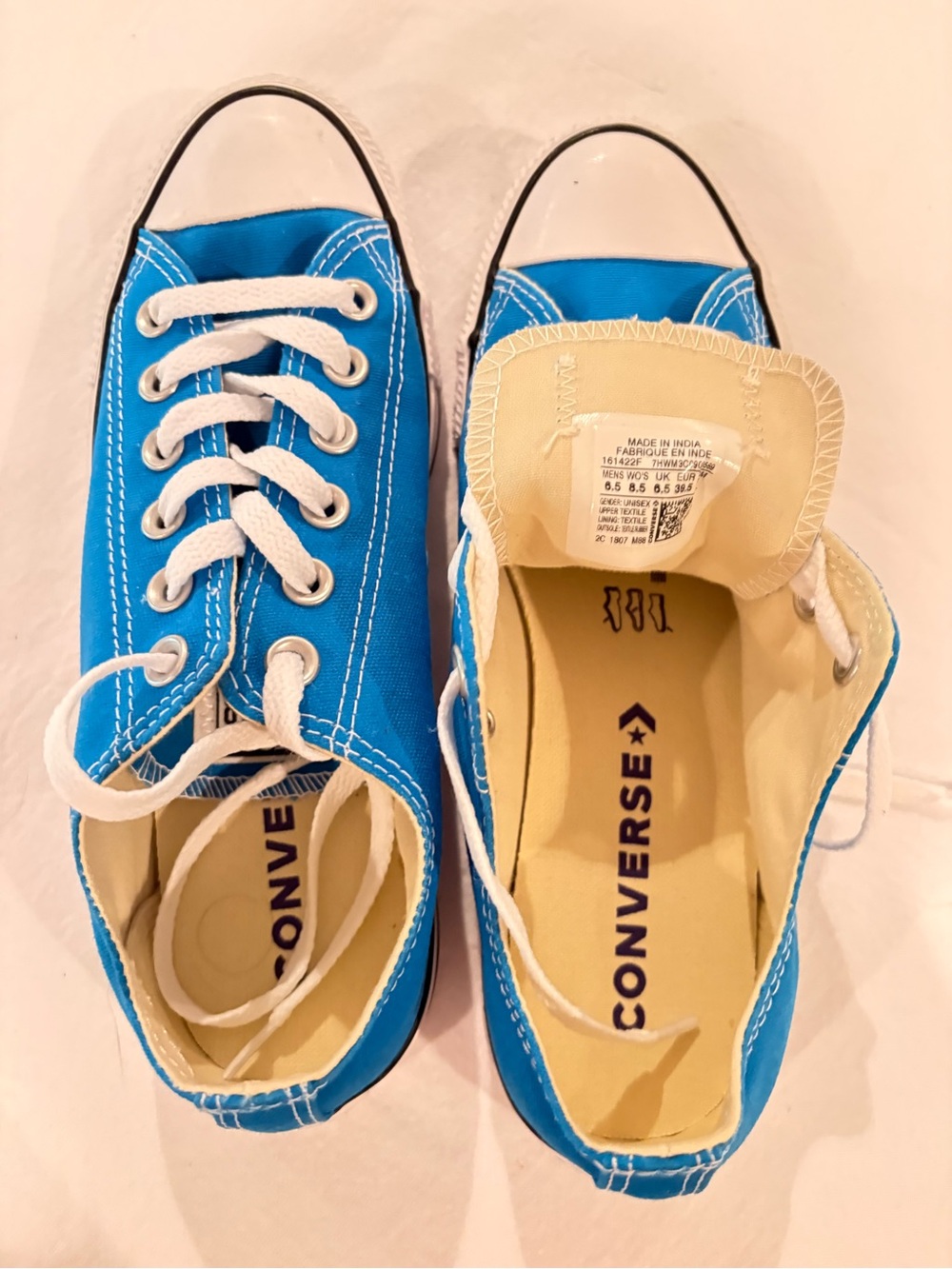 Converse men’s Low-Top Canvas Sneakers in Bright Blue with White Laces